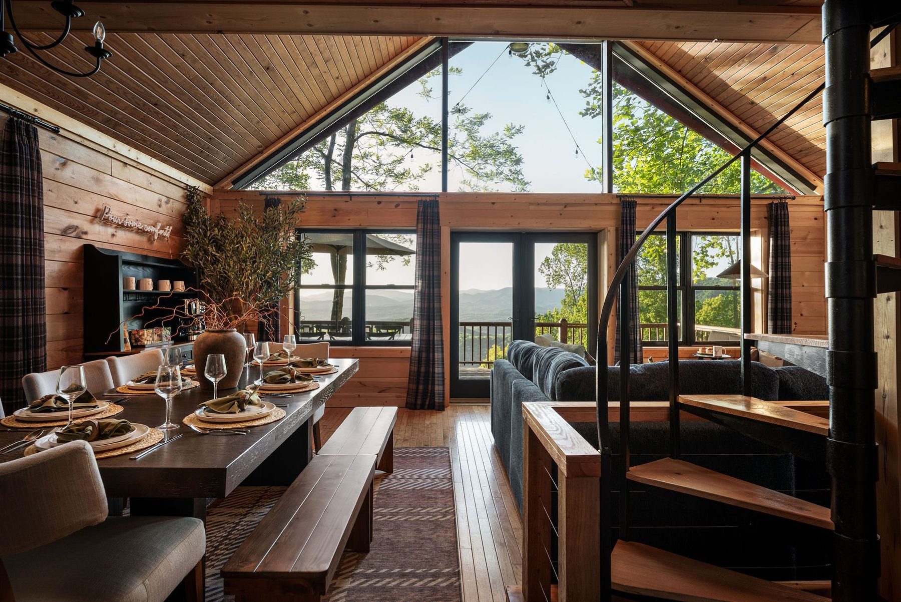Highland Pines Overlook: great room beneath an A-frame window onto the mountains