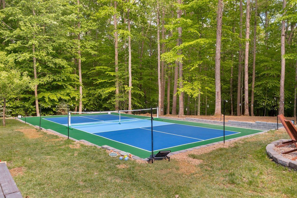 Pickleball court in blue and green set into the woods
