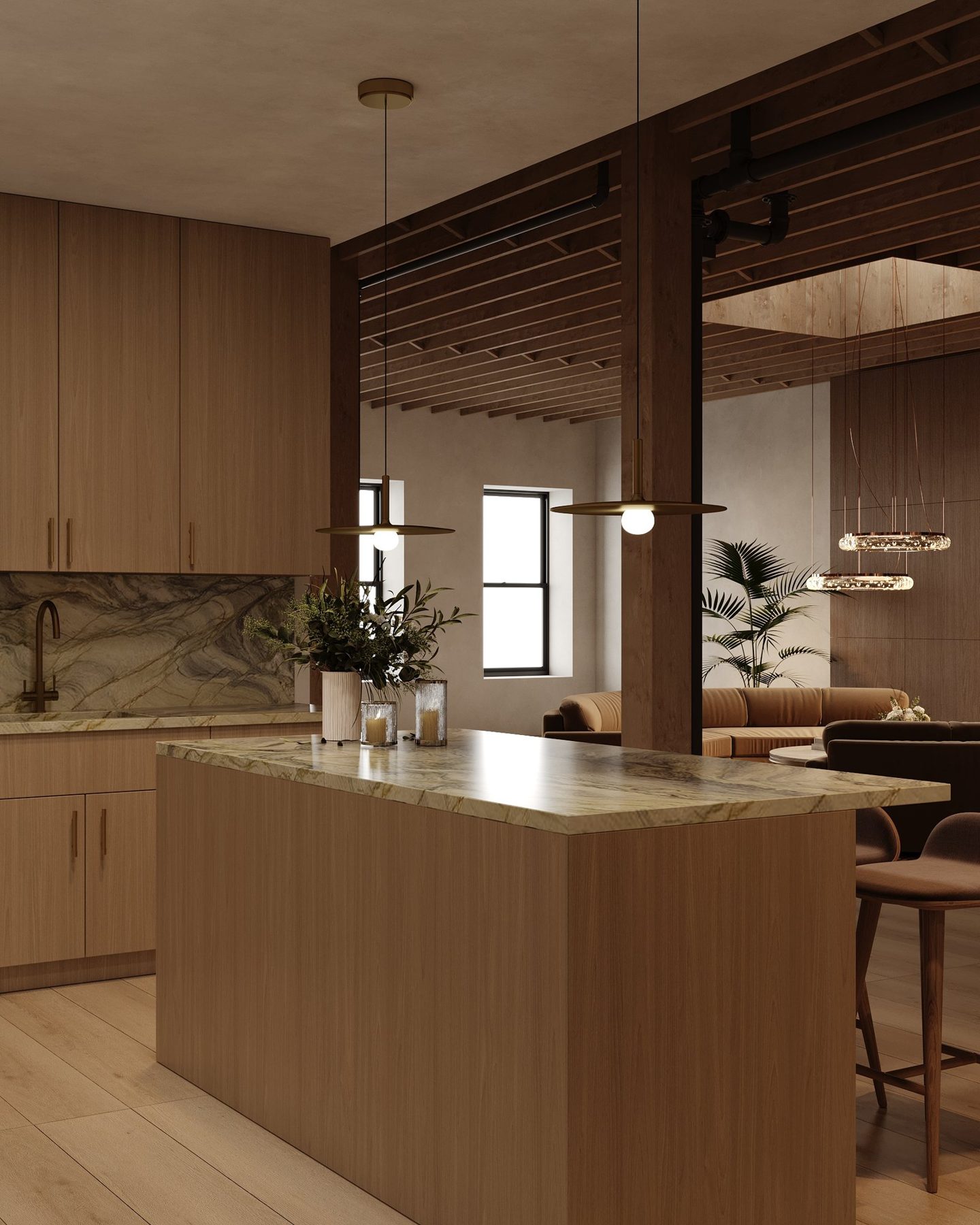 Oak island with a waterfall stone top opening onto the living space under exposed timber joists